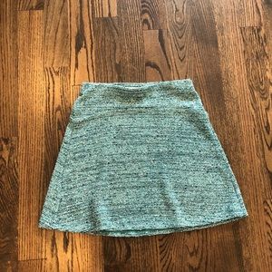 Green tweed flippy skirt